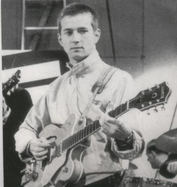 Um Eric Clapton adolescente e sua guitarra, começando a carreira.